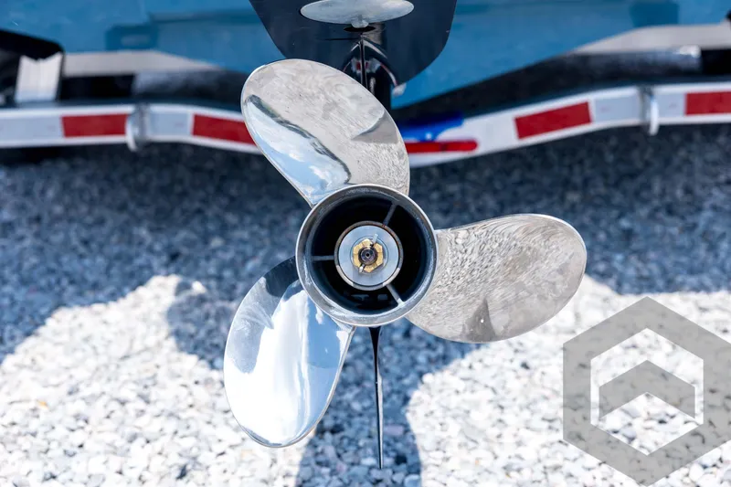 Slide: The Image of Close-up of a 2026 Tidewater 2110 Bay Max boat propeller on gravel. - 20