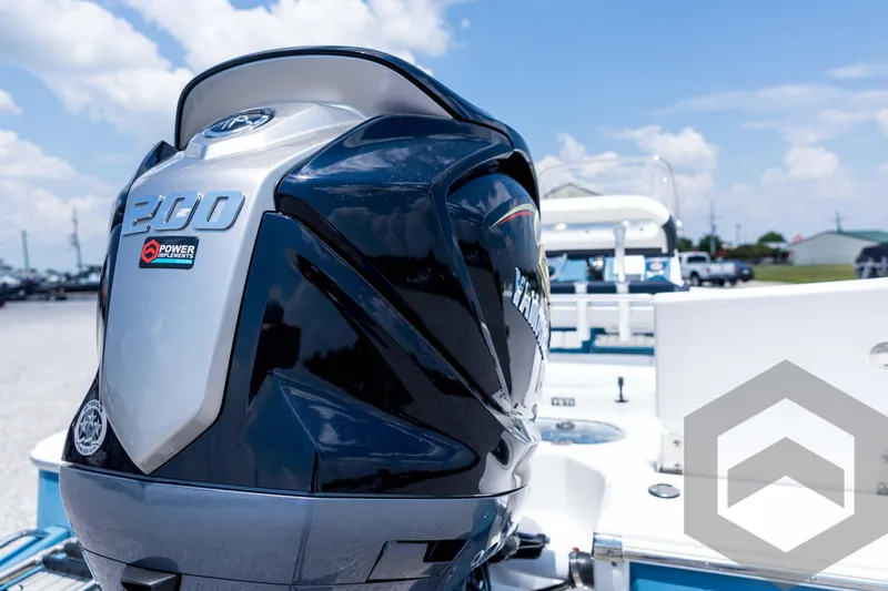Slide: The Image of 2026 Tidewater 2110 Bay Max boat with powerful 200 HP engine, sunny day background. - 28