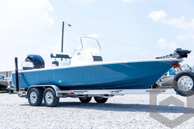 Slide: The Image of 2026 Tidewater 2110 Bay Max boat on trailer, blue hull, sunny day. - 3