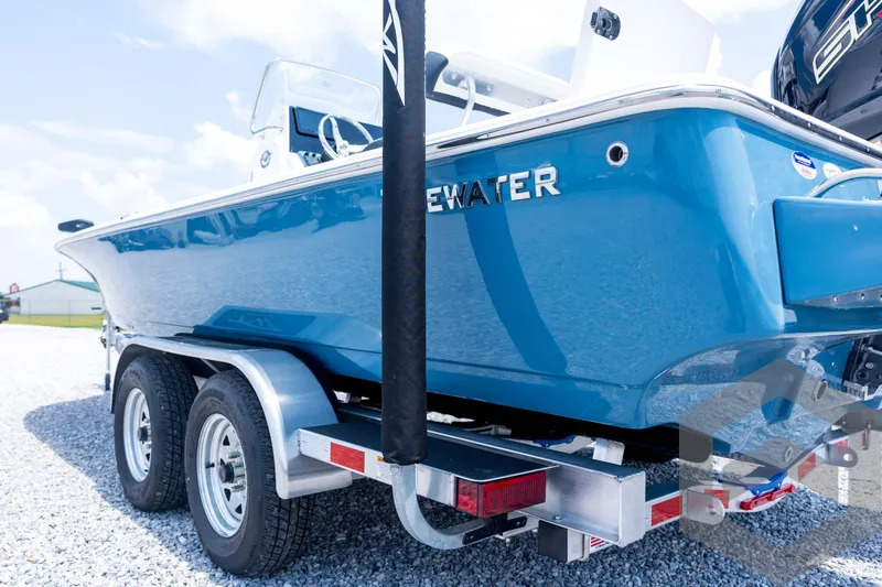 Slide: The Image of 2026 Tidewater 2110 Bay Max boat on trailer, blue hull, outdoor display. - 30