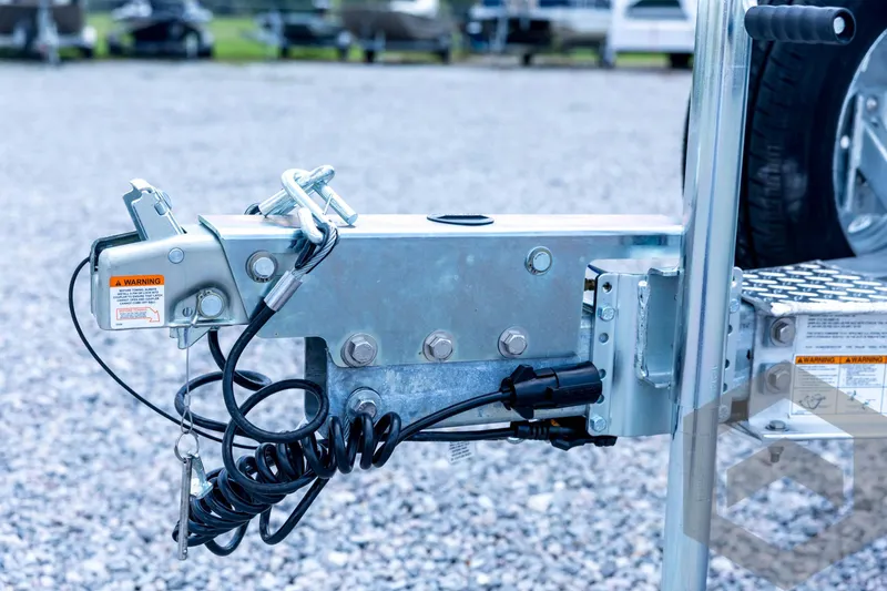 Slide: The Image of Trailer hitch of 2026 Tidewater 2110 Bay Max boat on gravel surface. - 37