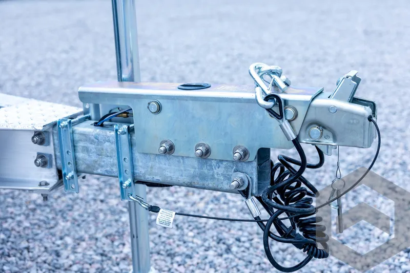 Slide: The Image of Trailer hitch mechanism for 2026 Tidewater 2110 Bay Max boat on gravel surface. - 38