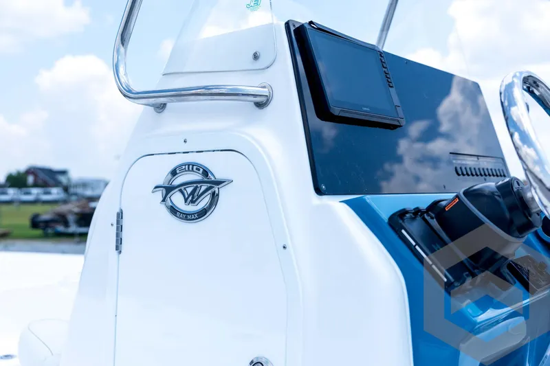 Slide: The Image of 2026 Tidewater 2110 Bay Max boat console with steering wheel and electronic display. - 39