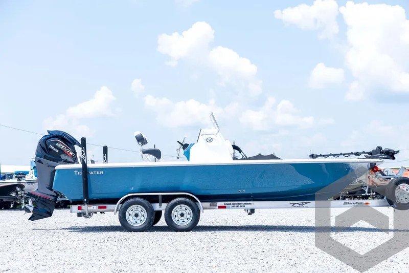 Slide: The Image of 2026 Tidewater 2110 Bay Max boat on trailer under clear sky. - 4