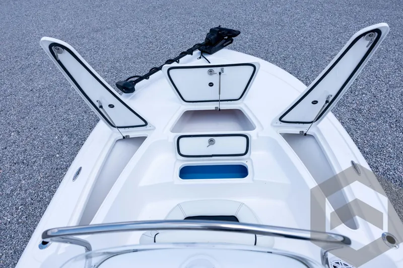 Slide: The Image of 2026 Tidewater 2110 Bay Max boat with open storage compartments on deck. - 46