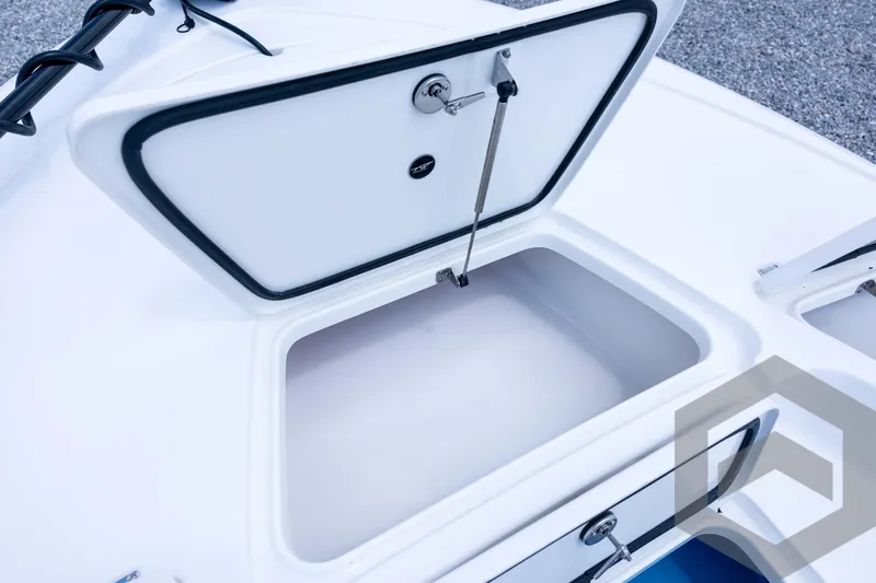 Slide: The Image of 2026 Tidewater 2110 Bay Max boat storage compartment open, showcasing interior space. - 49