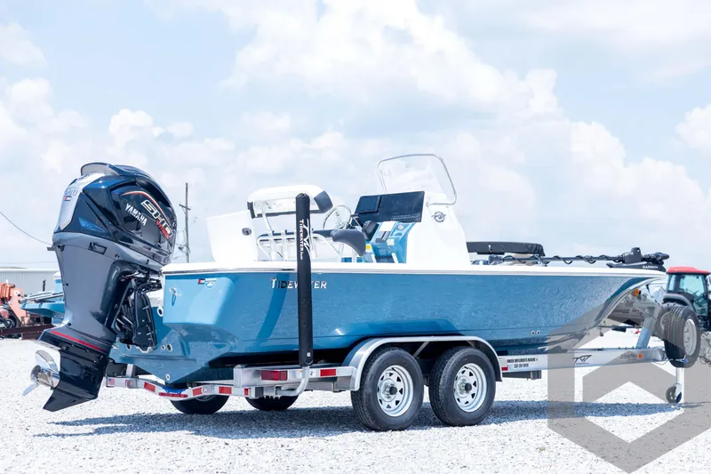 Slide: The Image of 2026 Tidewater 2110 Bay Max boat with Yamaha engine on trailer, outdoors. - 5
