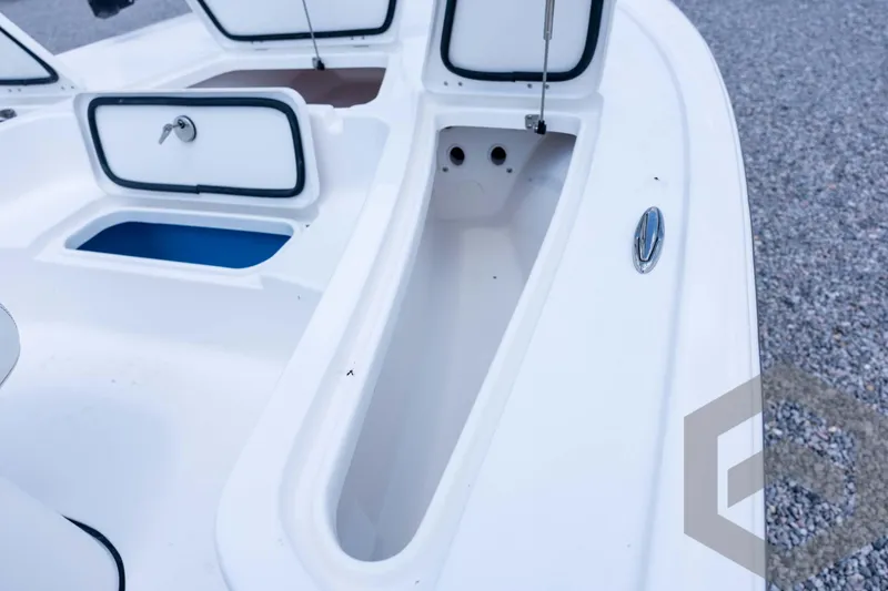 Slide: The Image of 2026 Tidewater 2110 Bay Max boat interior with open storage compartments. - 50
