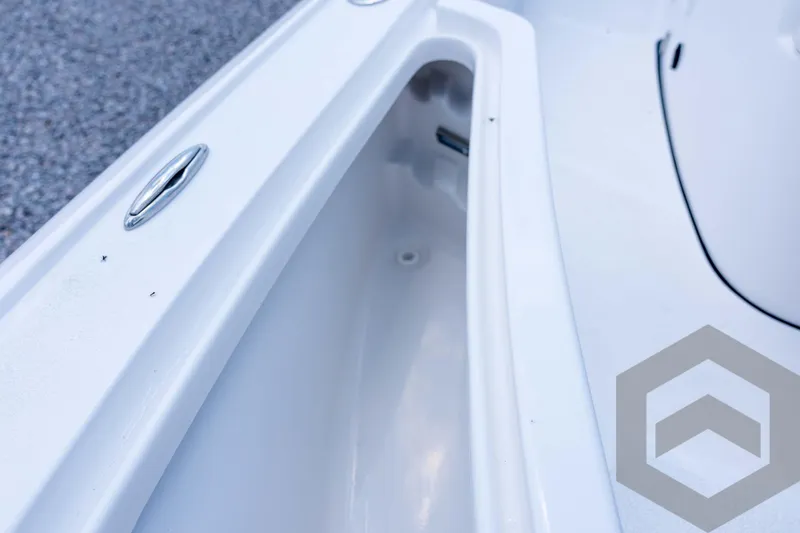 Slide: The Image of 2026 Tidewater 2110 Bay Max boat interior detail with storage compartment. - 52