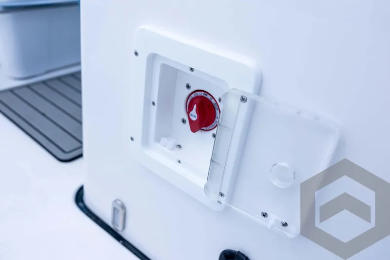 Slide: The Image of Tidewater 2110 Bay Max 2026 boat detail with red switch and protective cover. - 58