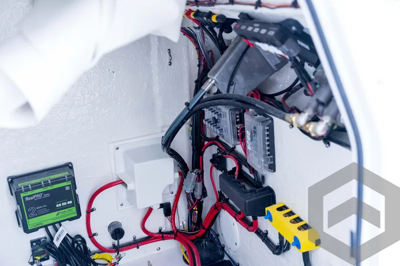 Slide: The Image of Electrical wiring and components inside a 2026 Tidewater 2110 Bay Max boat. - 61