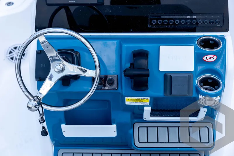 Slide: The Image of 2026 Tidewater 2110 Bay Max boat dashboard with steering wheel and controls. - 64