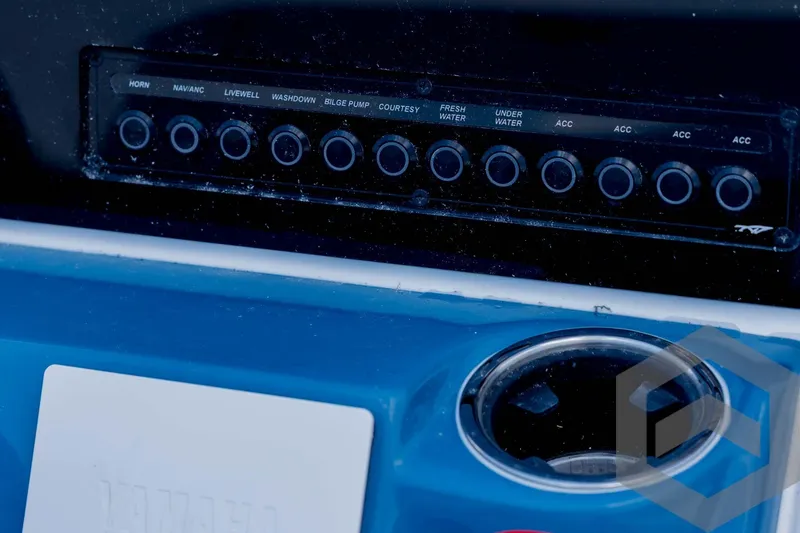 Slide: The Image of Control panel of 2026 Tidewater 2110 Bay Max boat with labeled switches. - 65