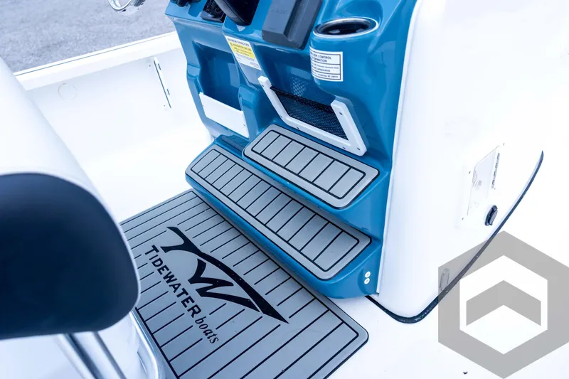 Slide: The Image of 2026 Tidewater 2110 Bay Max boat interior with non-slip flooring and console details. - 68