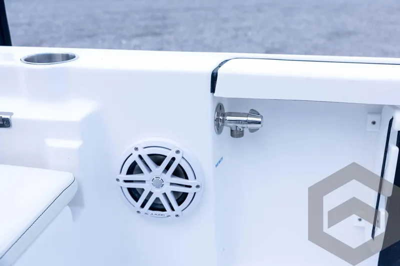 Slide: The Image of 2026 Tidewater 2110 Bay Max boat interior with speaker and cup holder. - 72
