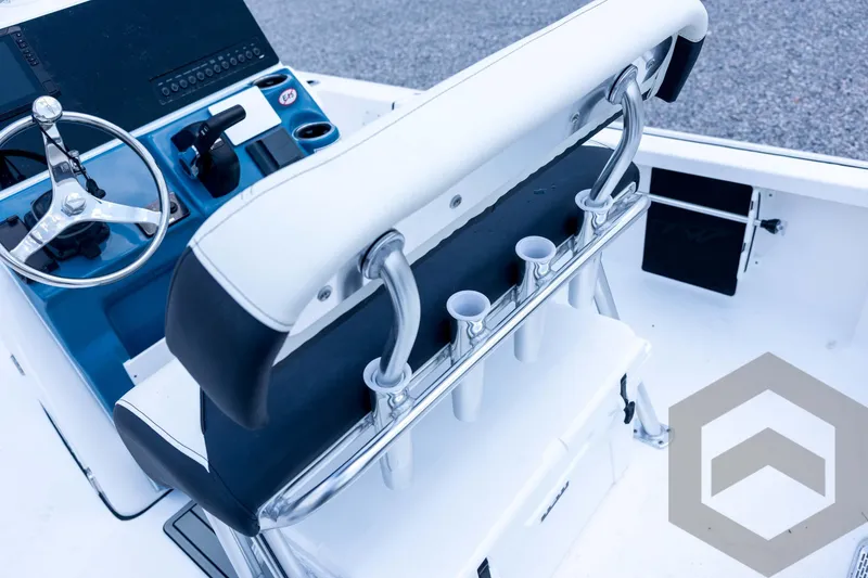 Slide: The Image of 2026 Tidewater 2110 Bay Max boat interior with steering wheel and rod holders. - 75