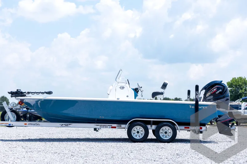 Slide: The Image of 2026 Tidewater 2110 Bay Max boat on trailer under blue sky. - 8