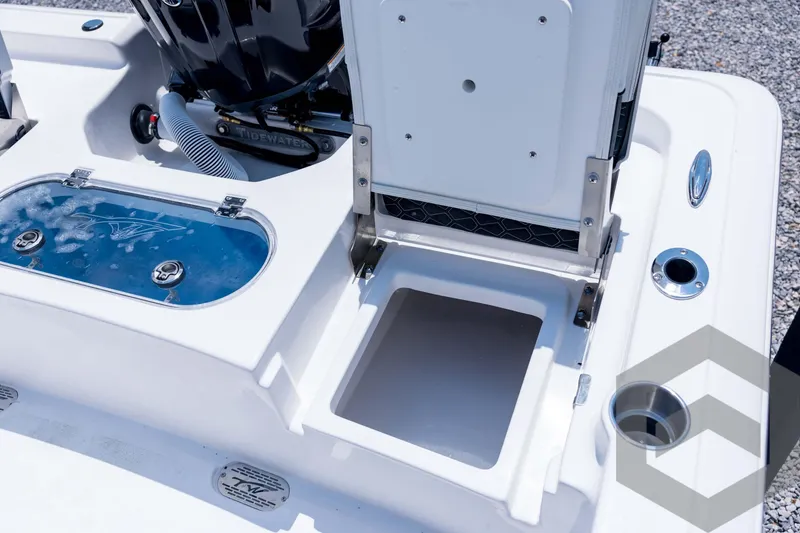 Slide: The Image of 2026 Tidewater 2110 Bay Max boat deck with storage compartments and livewell. - 83