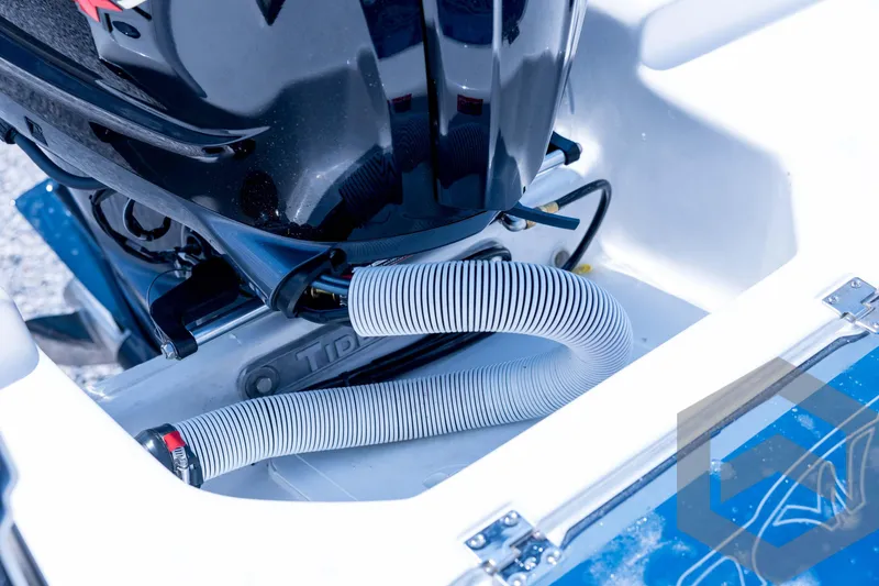 Slide: The Image of 2026 Tidewater 2110 Bay Max boat engine compartment with hoses and fittings. - 86