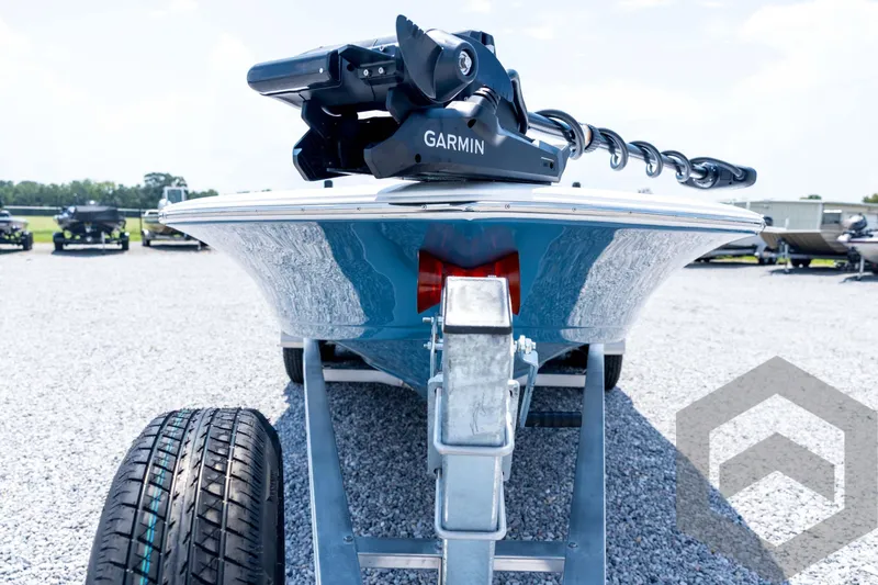 Slide: The Image of 2026 Tidewater 2110 Bay Max boat on trailer with Garmin equipment, parked on gravel. - 9