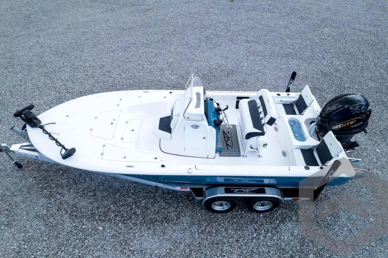 Slide: The Image of 2026 Tidewater 2110 Bay Max boat on trailer, featuring Yamaha engine, viewed from above. - 90