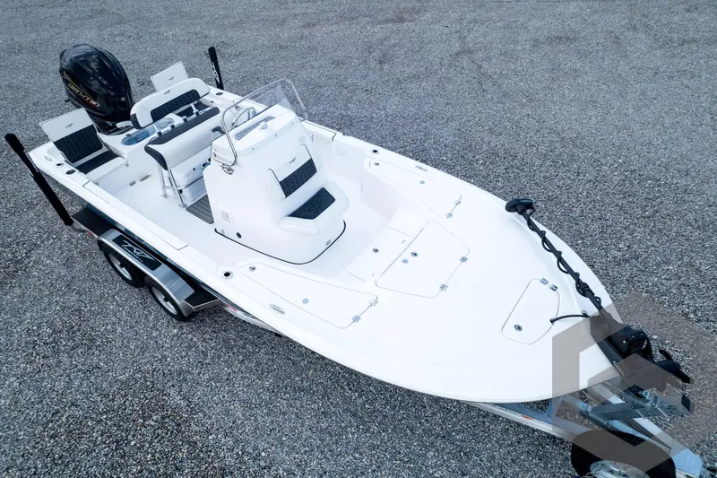 Slide: The Image of 2026 Tidewater 2110 Bay Max boat on trailer, white exterior, dual seats, outboard motor. - 93