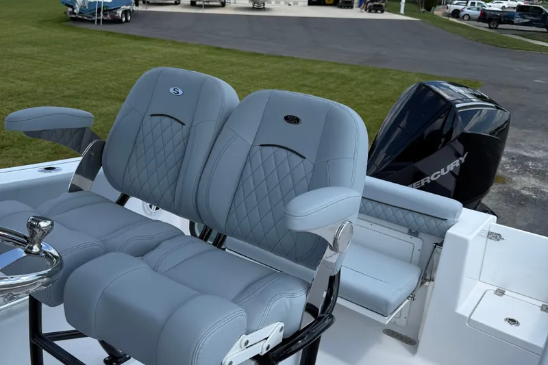 Slide: The Image of 2026 Sportsman Open 232 Center Console boat with luxurious seating and Mercury engine. - 3