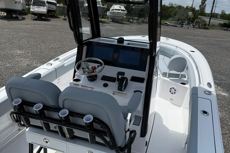 Slide: The Image of 2026 Sportsman Open 232 Center Console boat interior with modern helm and seating. - 4
