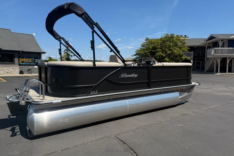 Slide: The Image of 2026 Bentley Pontoons LE 200 CW pontoon boat parked outdoors on a sunny day. - 4