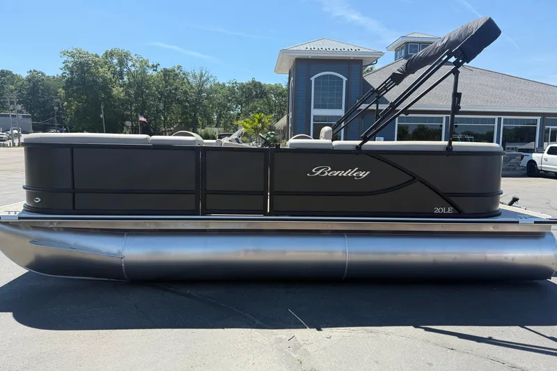 Slide: The Image of 2026 Bentley Pontoons LE 200 CW interior with beige seating and elegant design. - 6