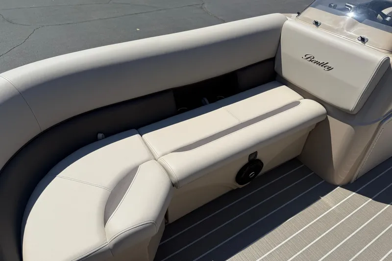 Slide: The Image of 2026 Bentley Pontoons LE 200 CW interior seating with beige and brown upholstery. - 7