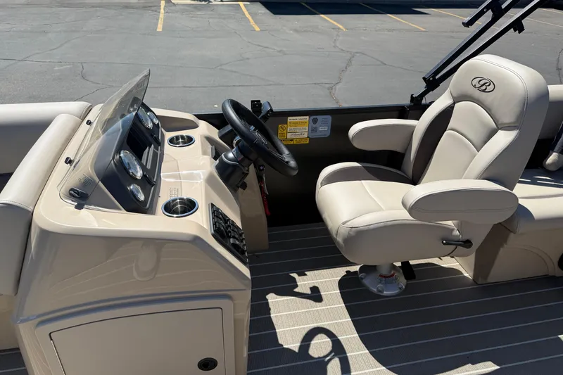 Slide: The Image of 2026 Bentley Pontoons LE 200 CW dashboard with steering wheel and control panel. - 9