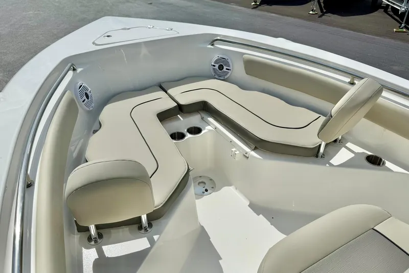 Slide: The Image of 2025 Key West 203 FS boat interior with cushioned seating and cup holders. - 11