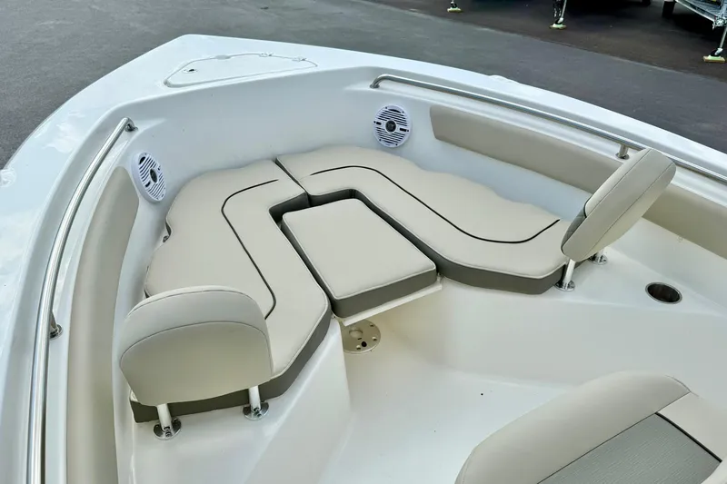 Slide: The Image of 2025 Key West 203 FS boat interior with cushioned seating and speakers. - 12