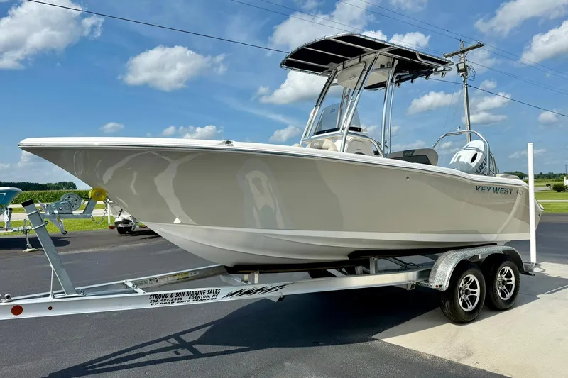 Slide: The Image of 2025 Key West 203 FS boat on trailer under blue sky. - 4