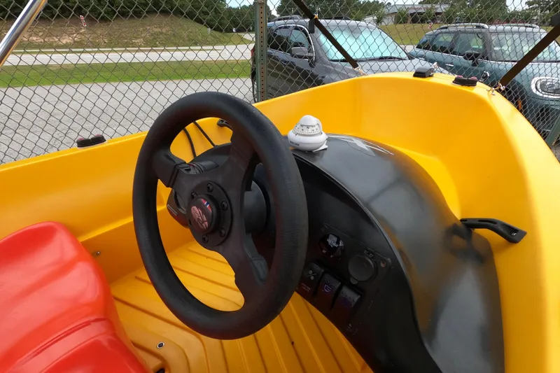 Slide: The Image of Yellow River Boats 290XR dashboard with steering wheel, 2022 model. - 7