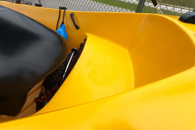 Slide: The Image of Yellow River Boats 290XR kayak interior, 2022 model, with black seat and accessories. - 8