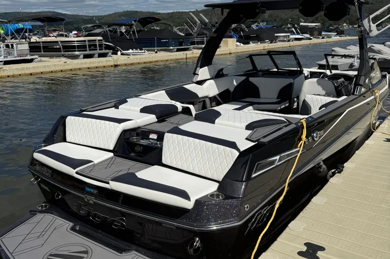 Slide: The Image of 2023 Tigé 24RZX boat docked, featuring sleek design and luxurious seating. - 4