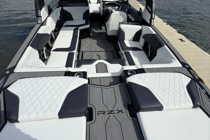 Slide: The Image of 2023 Tigé 24RZX boat interior with luxurious seating and modern design. - 9