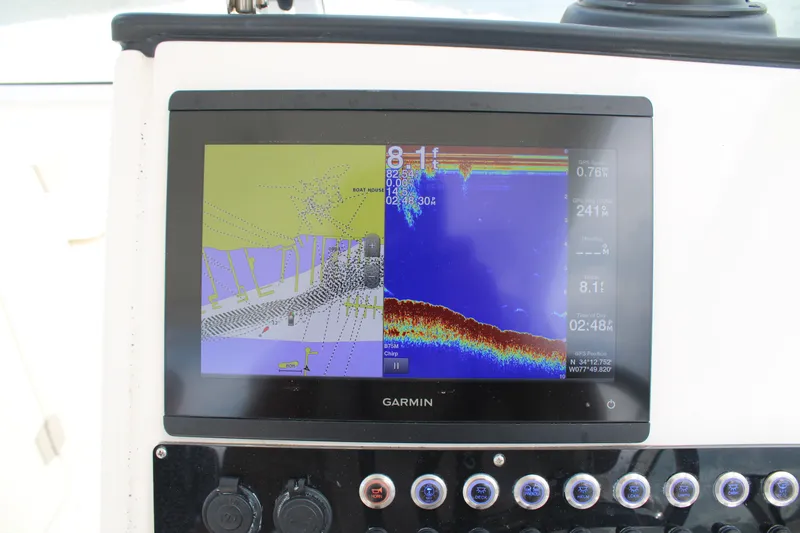 Slide: The Image of Garmin navigation display on 2020 Edgewater 230 CX boat, showing depth and GPS data. - 39