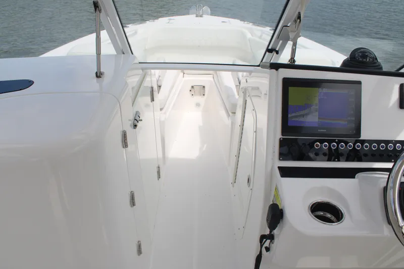 Slide: The Image of 2020 Edgewater 230 CX boat interior with navigation display and steering wheel. - 41