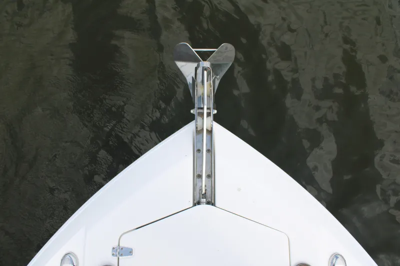 Slide: The Image of Bow of 2020 Edgewater 230 CX boat with anchor over water. - 47
