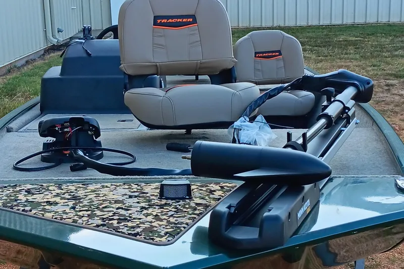 Slide: The Image of 2026 Tracker Bass Tracker Classic Limited boat with camo deck and comfortable seating. - 10