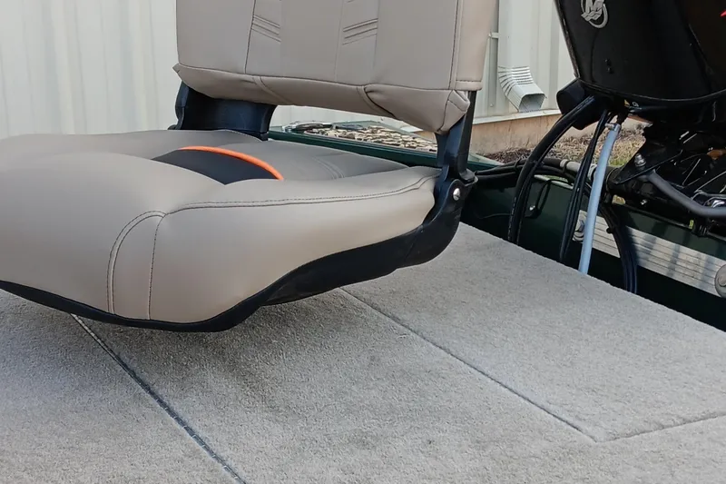 Slide: The Image of 2026 Tracker Bass Tracker Classic Limited boat seat on carpeted deck. - 17