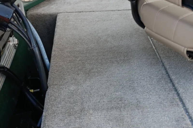 Slide: The Image of Interior view of 2026 Tracker Bass Tracker Classic Limited boat, featuring carpeted flooring and seating. - 8