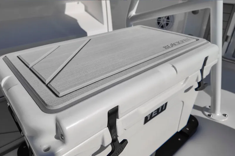 Slide: The Image of 2024 Blackfin 222 CC boat with Yeti cooler on deck. - 26
