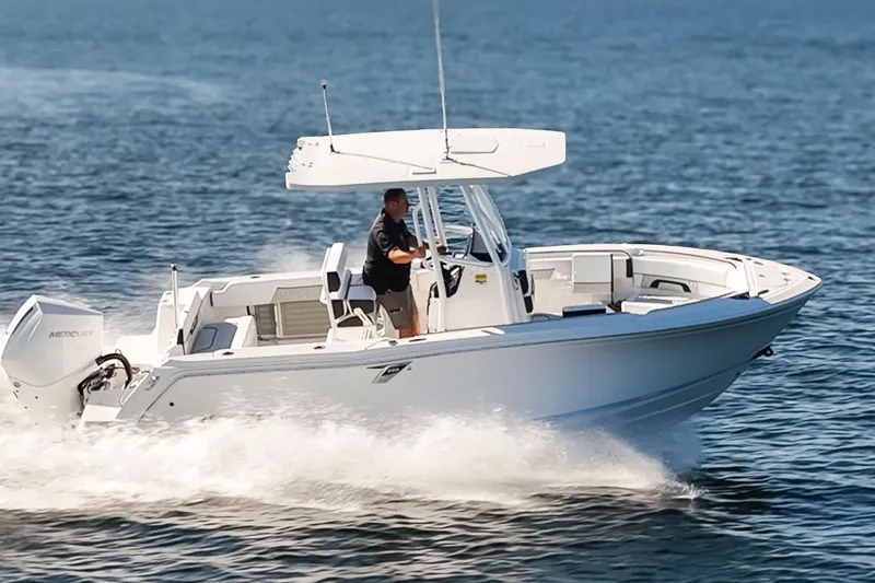 Slide: The Image of 2024 Blackfin 222 CC boat cruising on open water, showcasing sleek design and performance. - 6