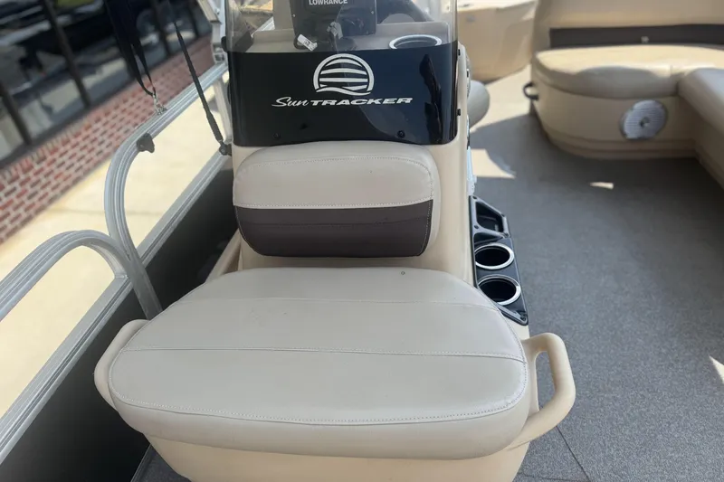 Slide: The Image of 2017 Sun Tracker Bass Buggy 18 DLX boat interior with seating and console. - 11