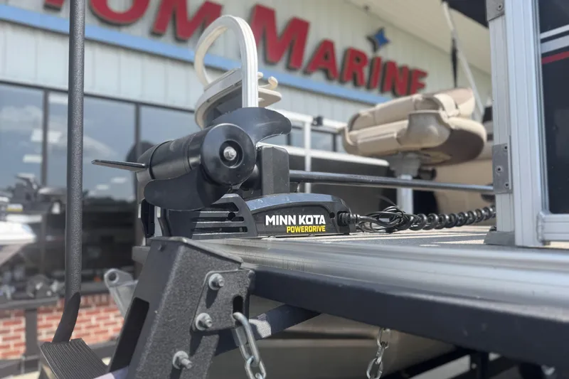 Slide: The Image of 2017 Sun Tracker Bass Buggy 18 DLX with Minn Kota PowerDrive motor at a marine store. - 15