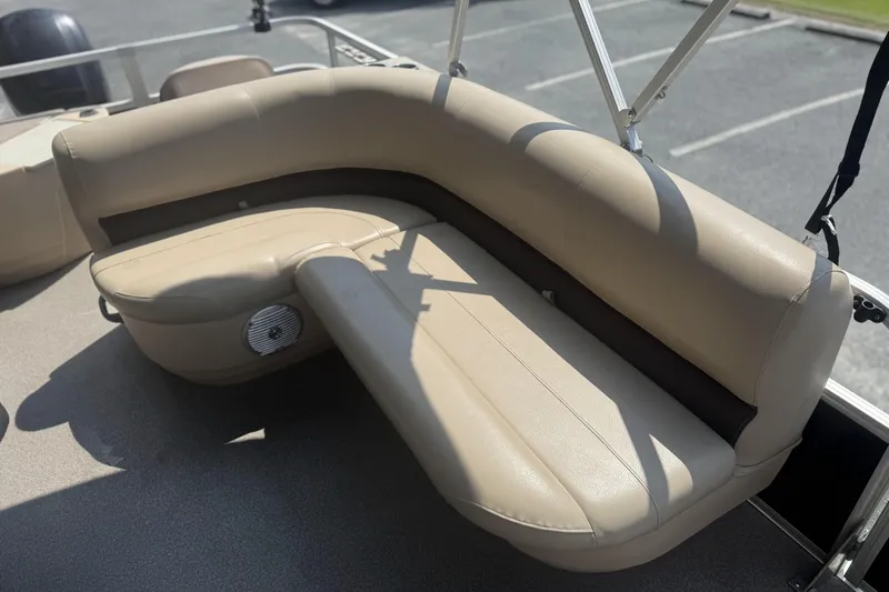Slide: The Image of 2017 Sun Tracker Bass Buggy 18 DLX boat with beige seating and speaker. - 16